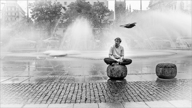 pensive man by fountain - “Poetry: A Survivor’s Guide” by Mark Yakich