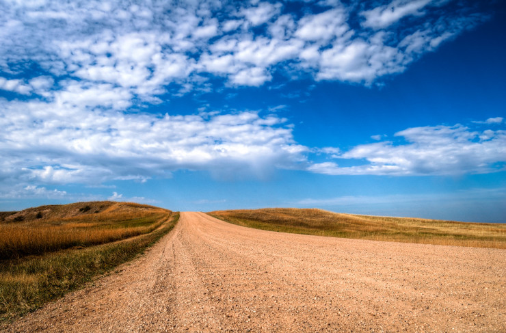 Confessions of a Serial Writer - gravel road and blue sky