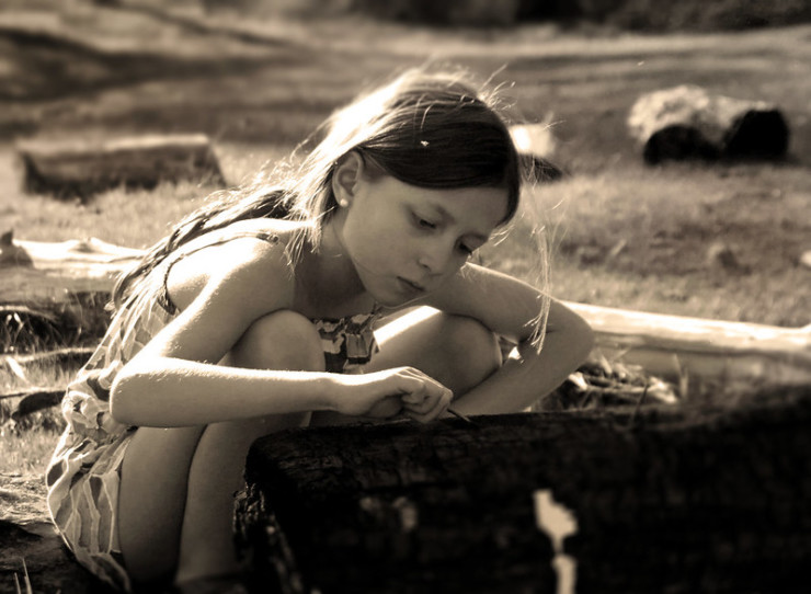 Ask Pearl girl playing with log