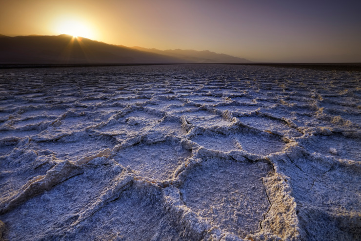 Death Valley with sunrise and darkness on the right