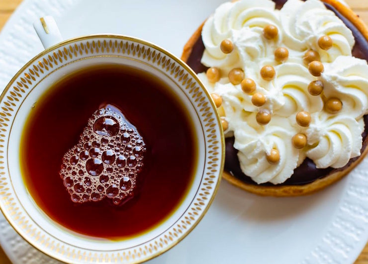 Cup of Tea and Chocolate Fudge with whipped cream Cacao Chemistry