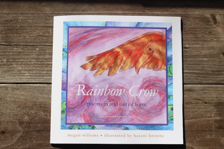 rainbow crow children's poetry on wood table