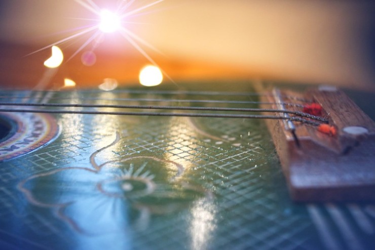 sunrise bokeh over guitar