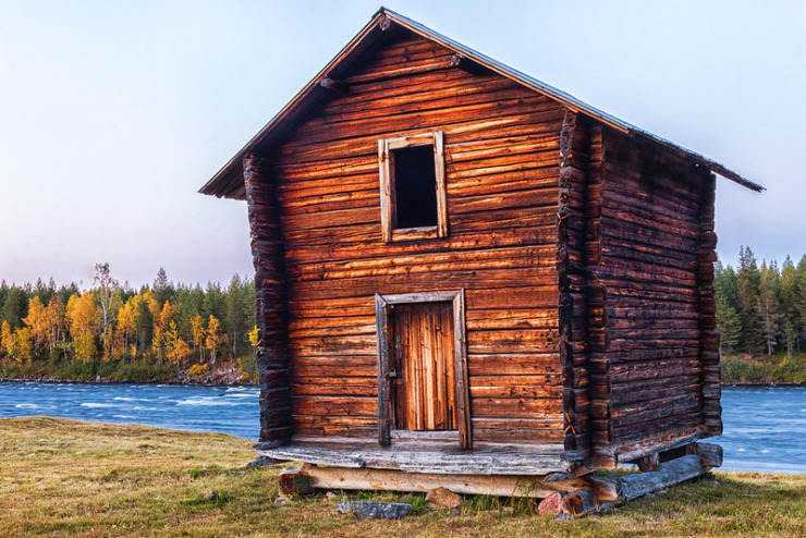 log cabin on creek