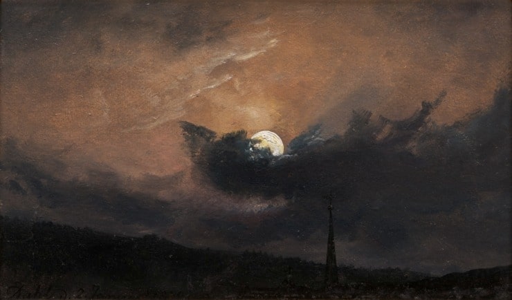 moon peeps behind a cloak during dusk 