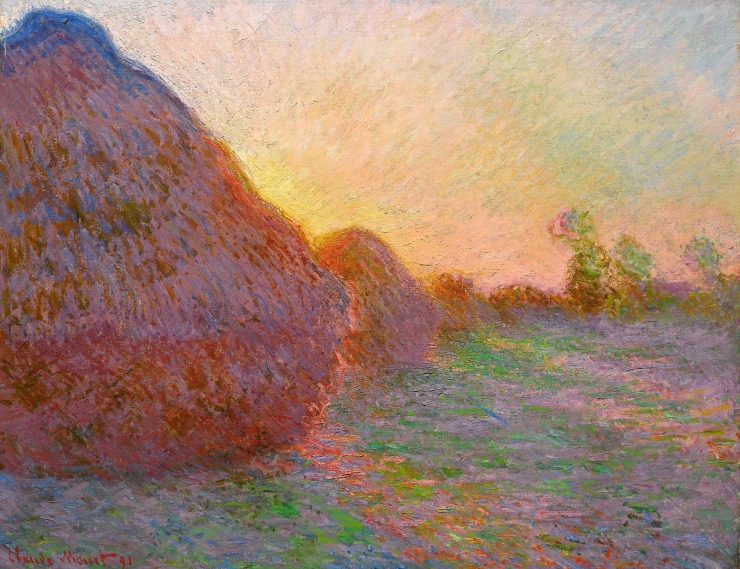 haystacks glimmer in the light of the sunrise 