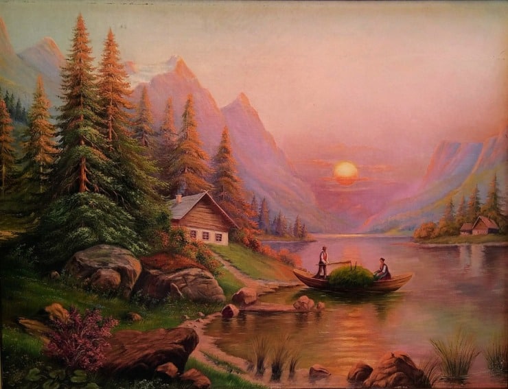 sunset on a cabin in woods with a man on a boat on the river in front of the cabin