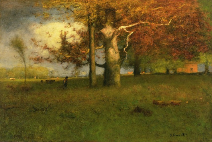 early autumn in a field with a big tree 